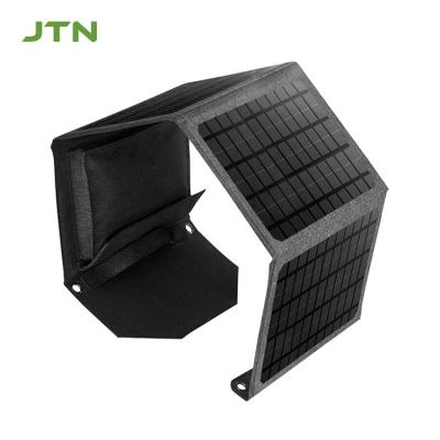 China Cargador de paneles solares de diseño plegable de 24W/30W para computadoras portátiles y teléfonos al aire libre en venta