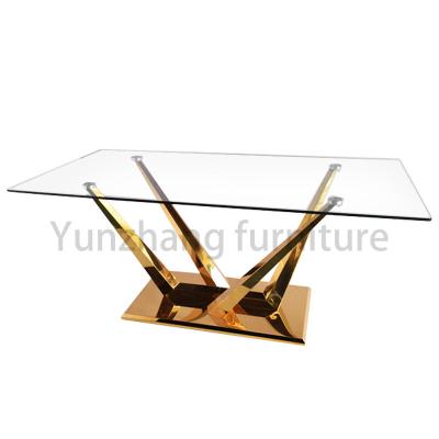 中国 ガラス卓上の金の鋼鉄ダイニング テーブルが付いている現代ホテルの家具 販売のため