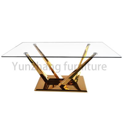 中国 Minimalist Rectangular Glass Top Dining Table With Solid SS201 Gold Plated Stand Base 販売のため