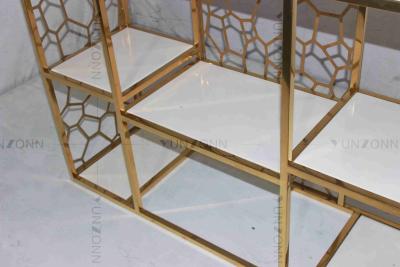 China Hollow Out Pattern Carving Design Storage Cabinets Marble Gold Plated Shelving for sale