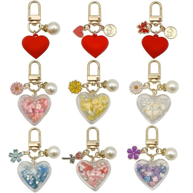 Heart-shaped red rose keychain with metal ring and rose detail, front view