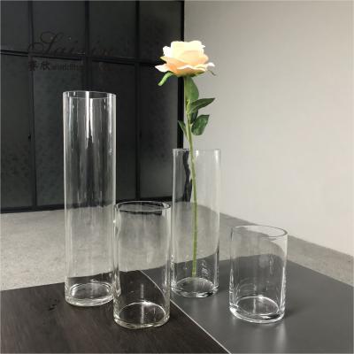 中国 Wholesale cheap wedding decoration different height glass cylinder vase 販売のため