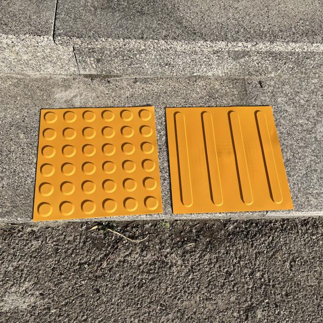 Tactile paving tiles installed in pedestrian area