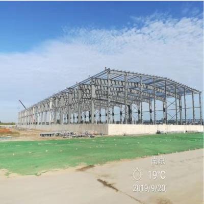 China Large Span Portal Frames 48m Decoiling Flat Roof Portal Frame 0.36mm for sale