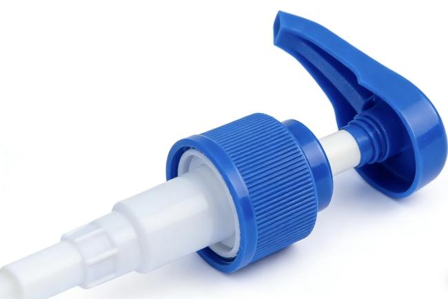Close-up view of lotion dispenser pump mechanism and construction details