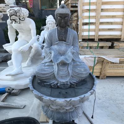 China BLVE Garden Buddha Statue Water Fountain Black Natural Stone Handcarved Life Size Holding Lotus Leaf for sale