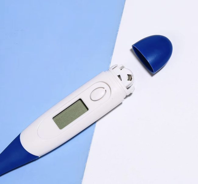 Children's digital electronic thermometer in use