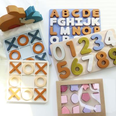 Chine En gros Puzzles en silicone XO entiers Logo personnalisé Marque de jouets de puzzles en silicone éducatifs pour bébés à vendre