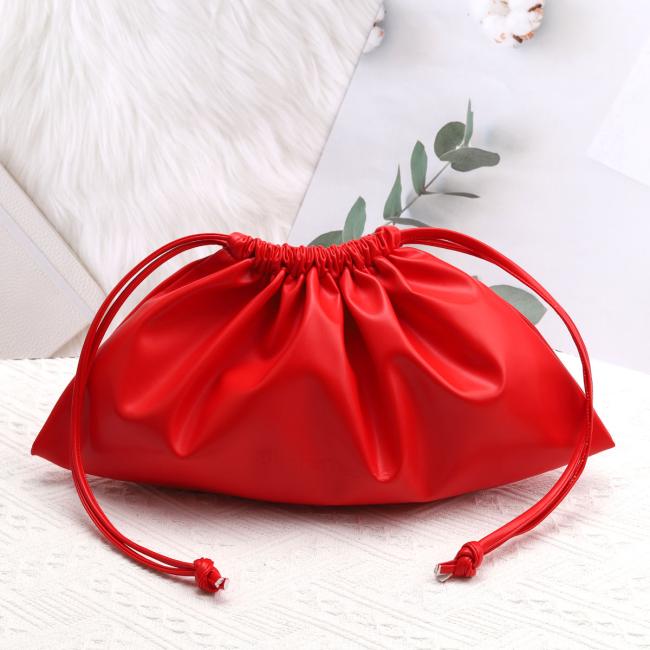 Custom logo emboss PU leather drawstring makeup bag in use
