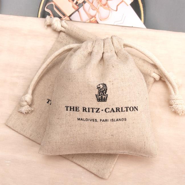 Multiple cotton linen pouches displayed together showing size comparison