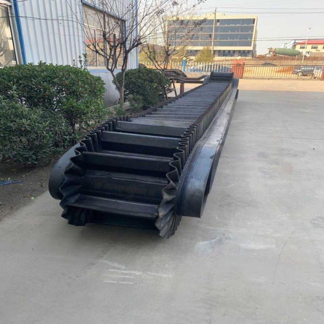 Corrugated Sidewall Conveyor Belt operating in industrial setting