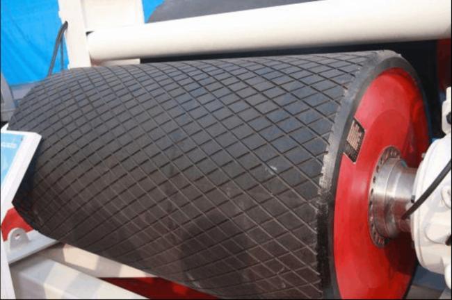 Rubber coated pulleys for conveyor systems
