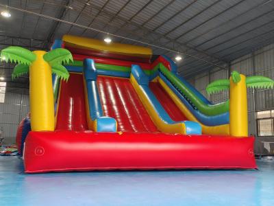 China New Design Tarpaulin Fireproof Commercial Inflatable High Slide Palm Theme Giant Inflatable Slide Castle For Kids And Ad for sale