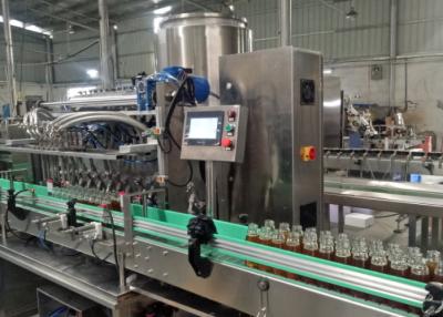 China Máquina de embalagem líquida volumétrico da garrafa de água da máquina de enchimento do mel profissional à venda