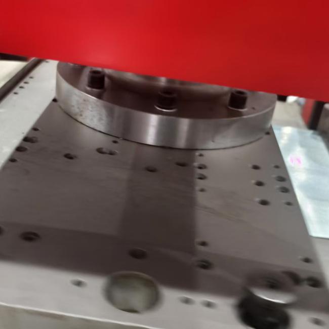 Close-up view of cable tray cover machine's hydraulic cutting system
