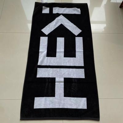 China 100% cotton thick warm soft terry customized design black white jacquard beach towel for sale