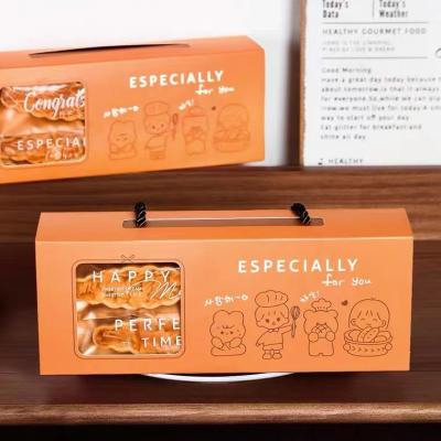 中国 食品包装のために型抜きされるオレンジ アート ペーパーの折り畳み式のギフト用の箱のリボン 販売のため