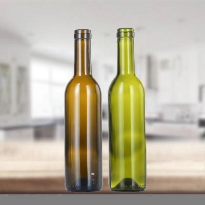 中国 ボルドーのガラス ビンの包装のための高い安全Emtptyのガラス ビン 販売のため