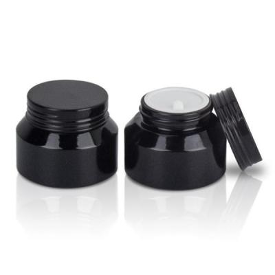 China 15g 30g 50g Empty Round Black Slant Shoulder Cream Glass Jar For Skin Care for sale