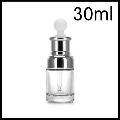 China Transparent Glass Cosmetic Bottles Silver Shoulder Collar White Bulp Dropper Essential Oil Vials for sale