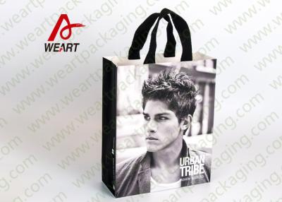 China Glued Special Handle Printed Paper Carrier Bags , Custom Recycled Shopping Bags For Retail Stores for sale