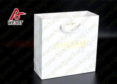 China Bright Golden Reusable Promotional Paper Bags For Retail Embossed LOGO for sale