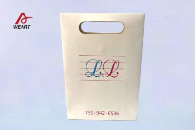 China Custom Matte Lamination Paper Shopping Bags With Cut Handle Bowknot For Boutique Store for sale