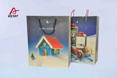 China Art Christmas Paper Bags , Unique Christmas Gift Bags Blue Cotton Handle for sale
