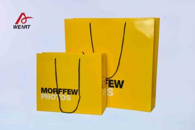 China 157 Gsm Art Paper Bags 2 Color Printing For Clothing Store Packaging for sale