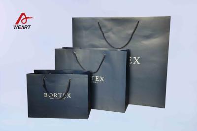 China Embossed Logo Art Paper Bags Different Design Style For Gift Daily Commodities for sale