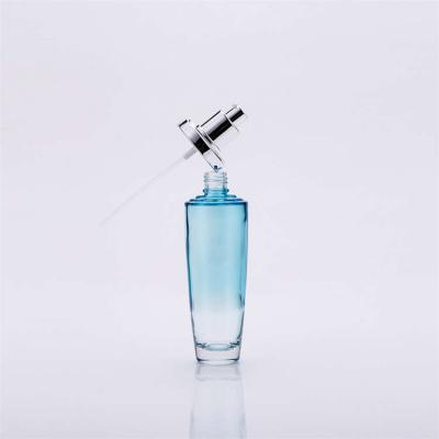 Chine La bouteille en verre cosmétique de gradient de couleur a placé ISO14001 multifonctionnel durable à vendre