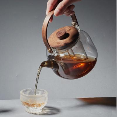 Chine Théière résistante à la chaleur en verre inodore de verrerie avec la poignée en bois lavable à vendre