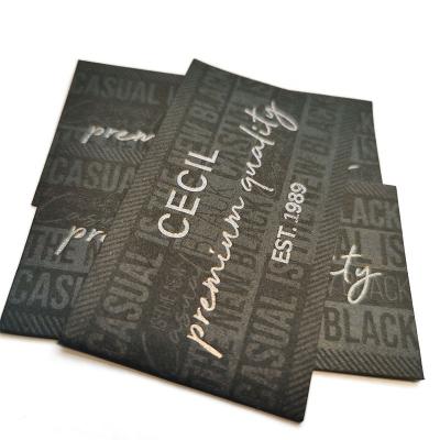 China Personalized Luxury Jacron Label Foil Printed Black Custom Garments Labels en venta