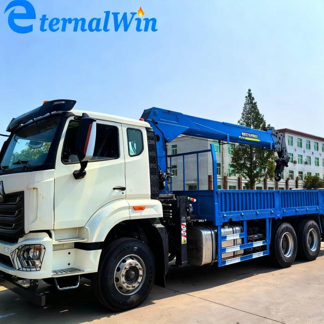 Close-up view of truck mounted crane hydraulic system and controls
