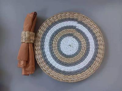 China Hot Sale Eco- friendly Handmade Natural Water Hyacinth Woven Table Placemat Seagrass Rattan Straw Placemats Mats for sale