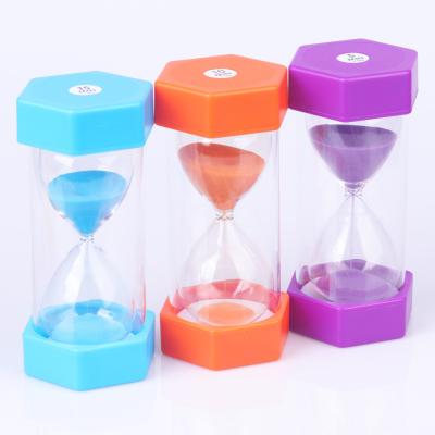 China Muestra libre del reloj de arena hexagonal plástico del reloj de arena del contador de tiempo de la arena de los niños en venta