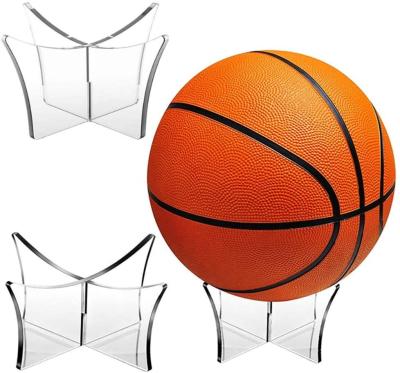 China Pintura de basquetebol de plástico acrílico transparente porta-cassete de basquetebol transparente pedestal redondo pedra preciosa basquetebol à venda