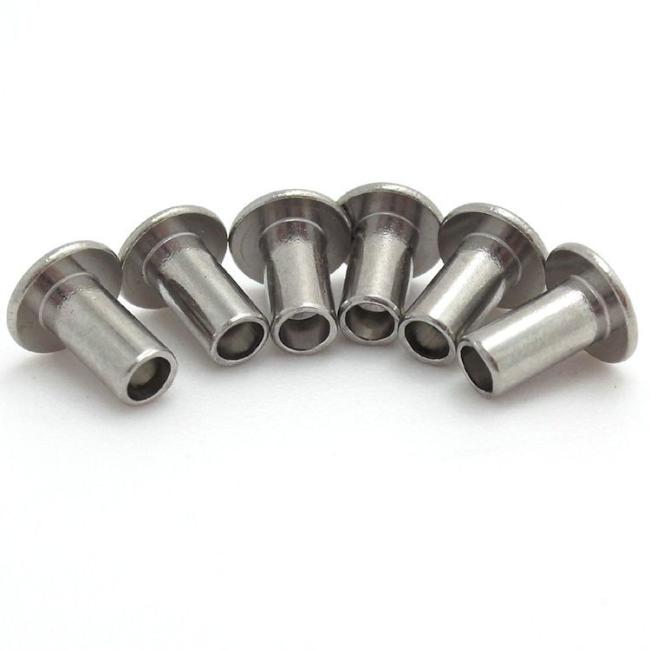 Detailed view of concrete nail threading and countersunk head