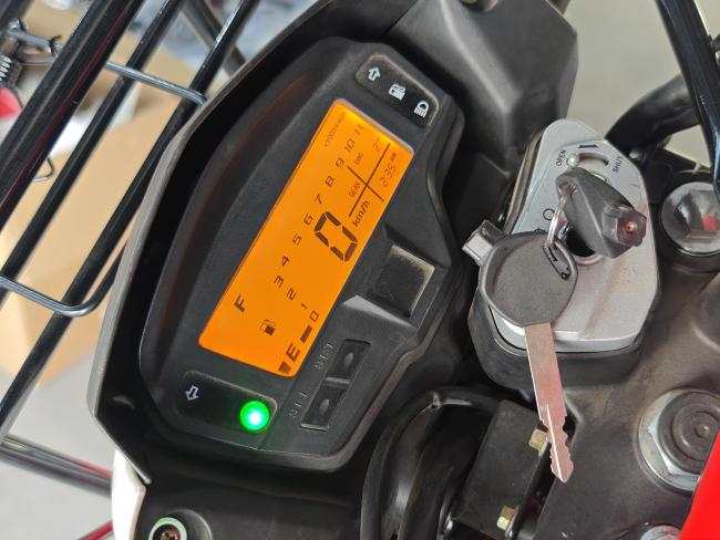 Close-up of the 200cc motorcycle engine and exhaust system