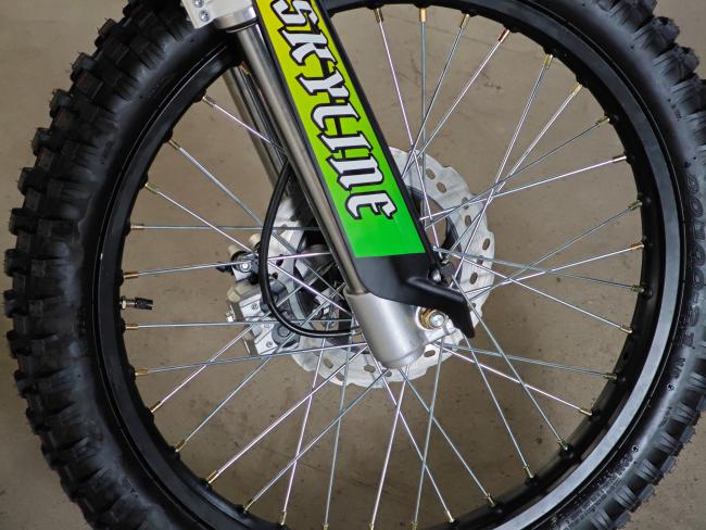 Rear view showing drum brake and deep-tread tire