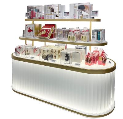 China Estante de exhibición oval cosmético de acrílico de niveles múltiples creativo de la tienda del gabinete de exhibición que brilla intensamente en venta