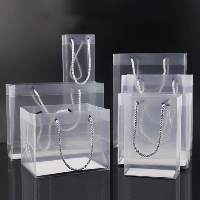 Custom logo printed wholesale gift transparent pp plastic handle bag for shopping
