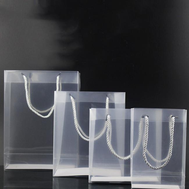 Custom logo printed wholesale gift transparent pp plastic handle bag for shopping