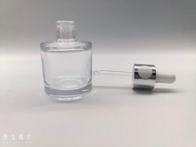 China Glass Button Dropper Bottle Slopy Shoulder 35ml Personal Care Packaging for sale