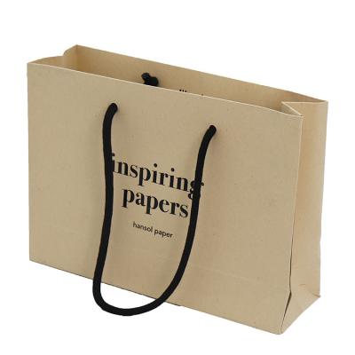 China Biodegradable Custom Printed Paper Shopping Bags Durable Kraft Paper Material for sale