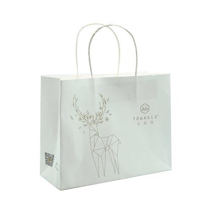 Chine Les sacs de papier personnalisés recyclables de cadeau, ont annoncé des sacs en papier pour l'empaquetage à vendre