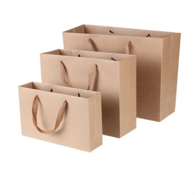China Las bolsas de papel impresas biodegradables de Brown, regalo del papel de Kraft empaquetan alta durabilidad en venta