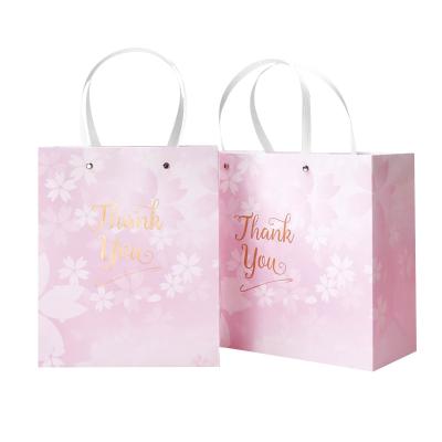China Beautiful Custom Printed Gift Bags Smooth Customized Logo With Flat Handle for sale