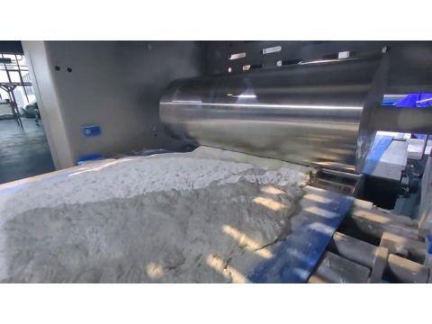 Heavy-duty reduction rollers calibrating the continuous ciabatta dough band to its final uniform baking thickness.