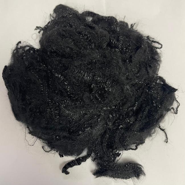 Pre-oxidized staple fiber close-up showing uniform black filaments